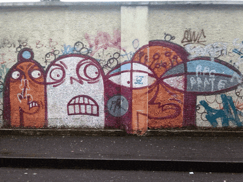 animated graffiti on a wall watching a car passing by