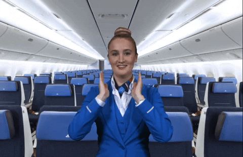 A stewardess gives directions.
